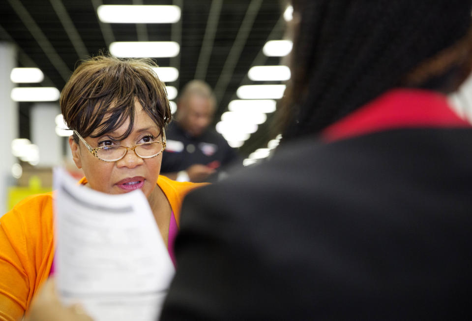 Homeowner Sandra Sims attempts to lower her monthly mortgage payment at a mortgage relief event. (AP Photo/David Goldman, AP Photo)