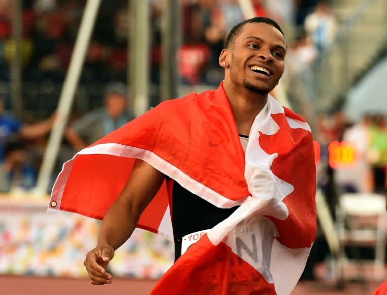 Andre De Grasse celebrates after winning the gold medal in the men's 4x100m relay finals of the 2015 Pan American Games, at the CIBC Athletics Stadium in Toronto, Canada, on July 25, 2015
