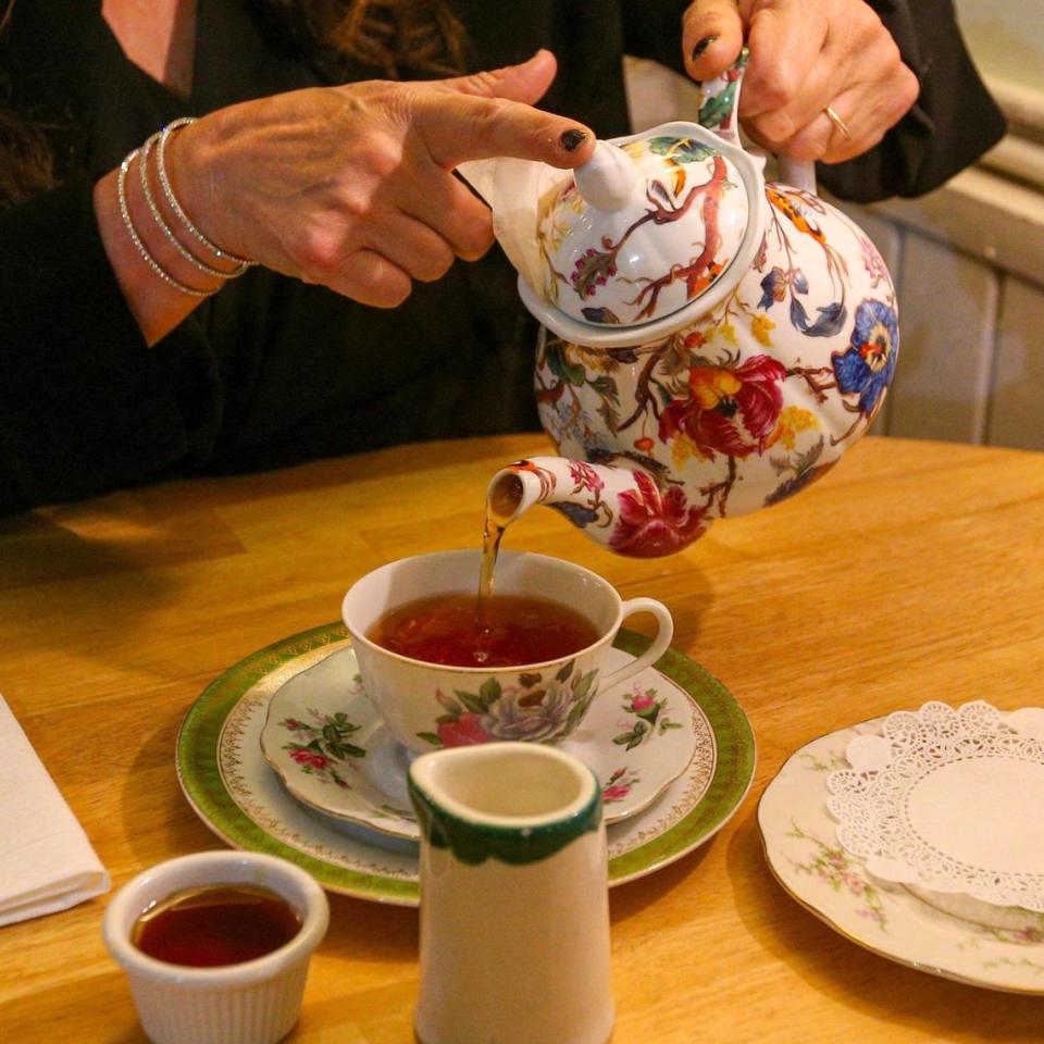 A patron pours herself tea while dining at The Tea Room at Cauley Square in Miami, Florida, on Thursday, Jan. 21, 2022.