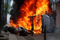 <p>A car burns outside a Renault automobile garage during clashes at the May Day labour union march in Paris, France, May 1, 2018. (Photo: Christian Hartmann/Reuters) </p>