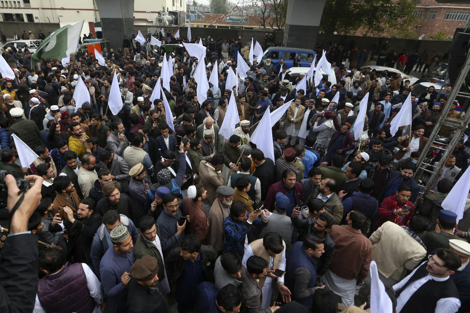 Supporters of Pakistan Tehreek-e-Insaf party take part in a rally denouncing militant attacks and demanding peace in the country, in Peshawar, Pakistan, Friday, Feb. 3, 2023. (AP Photo/Muhammad Sajjad)