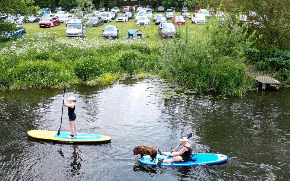 Paddle boards along the river Avon in Warwick - Jacob King/PA