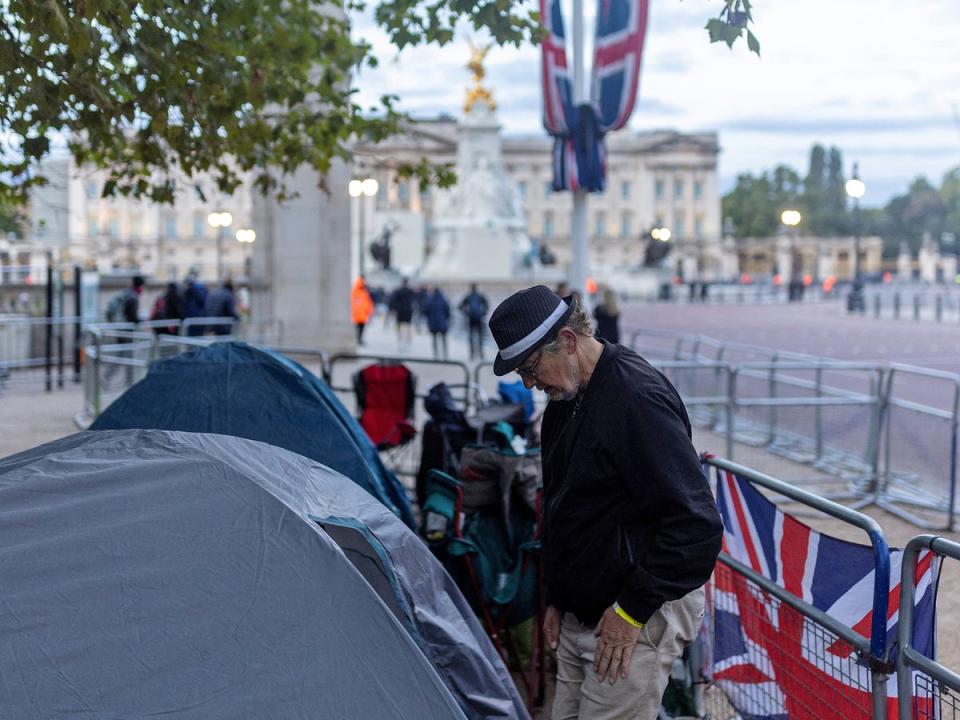 18 September 2022: A man stands among campers on The Mall ahead of the Queen’s funeral (Reuters)