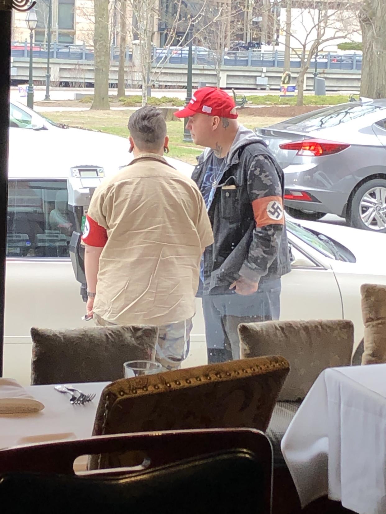 A couple wearing Nazi armbands and "White Lives Matter" pins were allegedly spotted disrespecting a Holocaust Memorial site in Providence, Rhode Island. (Photo: Courtesy of Sondra Pierson)