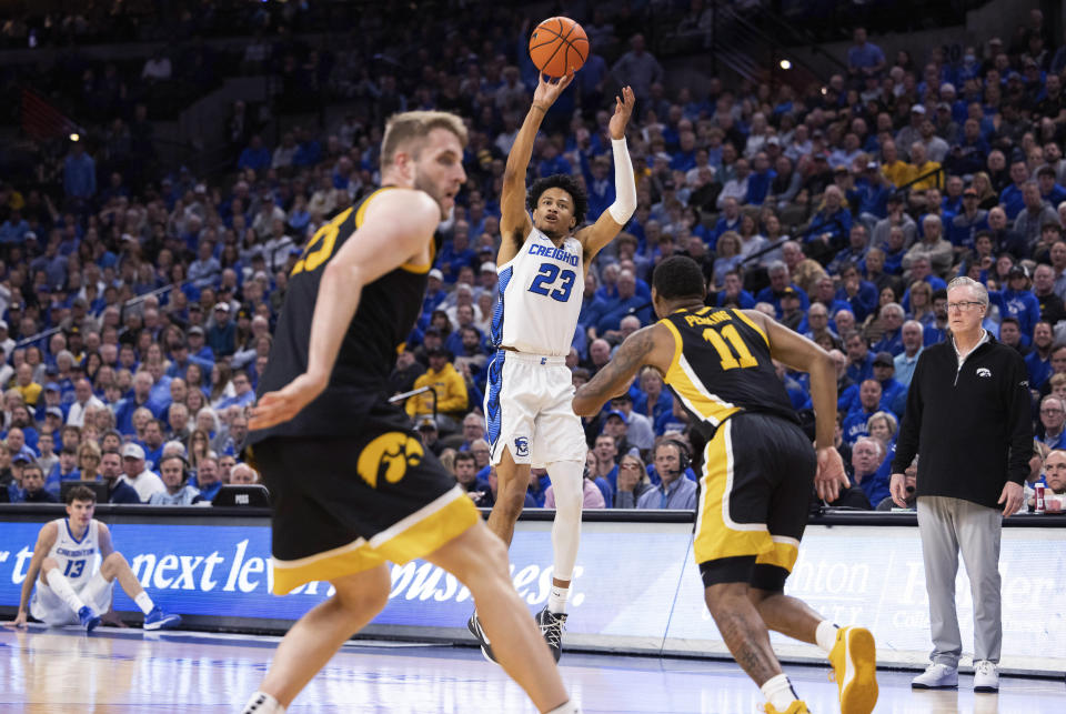 Creighton's Trey Alexander (23) shoots against Iowa defenders, including Tony Perkins (11), during the first half of an NCAA college basketball game Tuesday, Nov. 14, 2023, in Omaha, Neb. (AP Photo/Rebecca S. Gratz)
