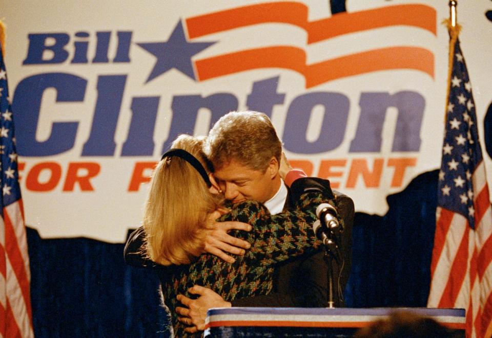 Bill and Hillary Clinton celebrate after winning the Illinois primary March 1992.