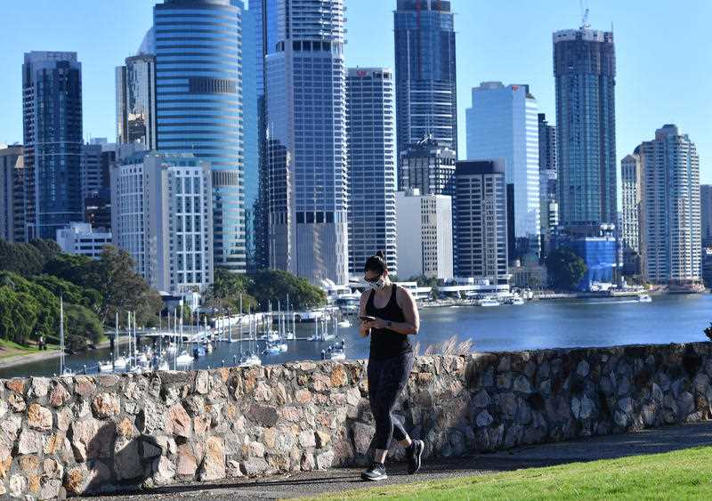 A woman is seen exercising at Kangaroo Point in Brisbane.