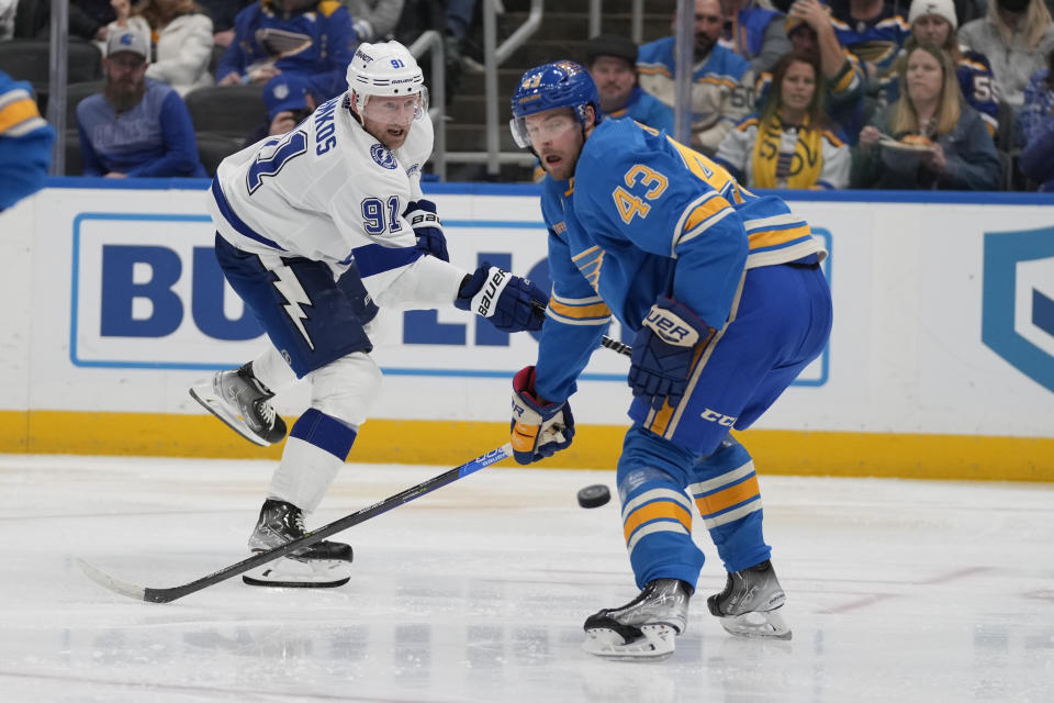 Tampa Bay Lightning's Steven Stamkos (91) shoots past St. Louis Blues' Calle Rosen (43) during the third period of an NHL hockey game Saturday, Jan. 14, 2023, in St. Louis. (AP Photo/Jeff Roberson)