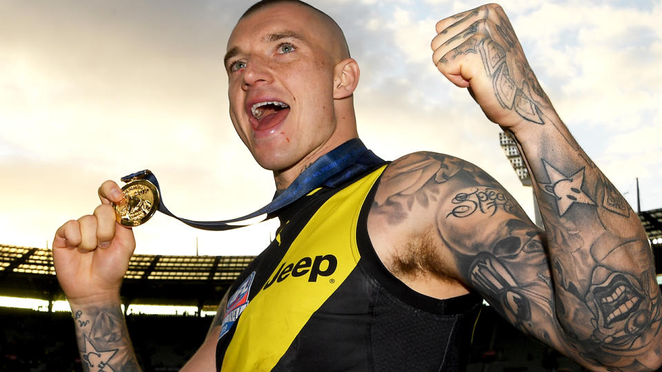 Dustin Martin, pictured celebrating his second North Smith medal and AFL premiership with Richmond.