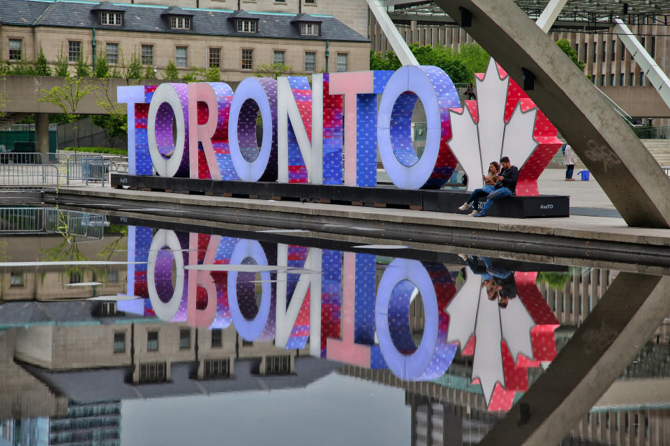 Sign in Toronto illuminated with the colors of the United Kingdom flag as a tribute to victims of the terror attack in Manchester.