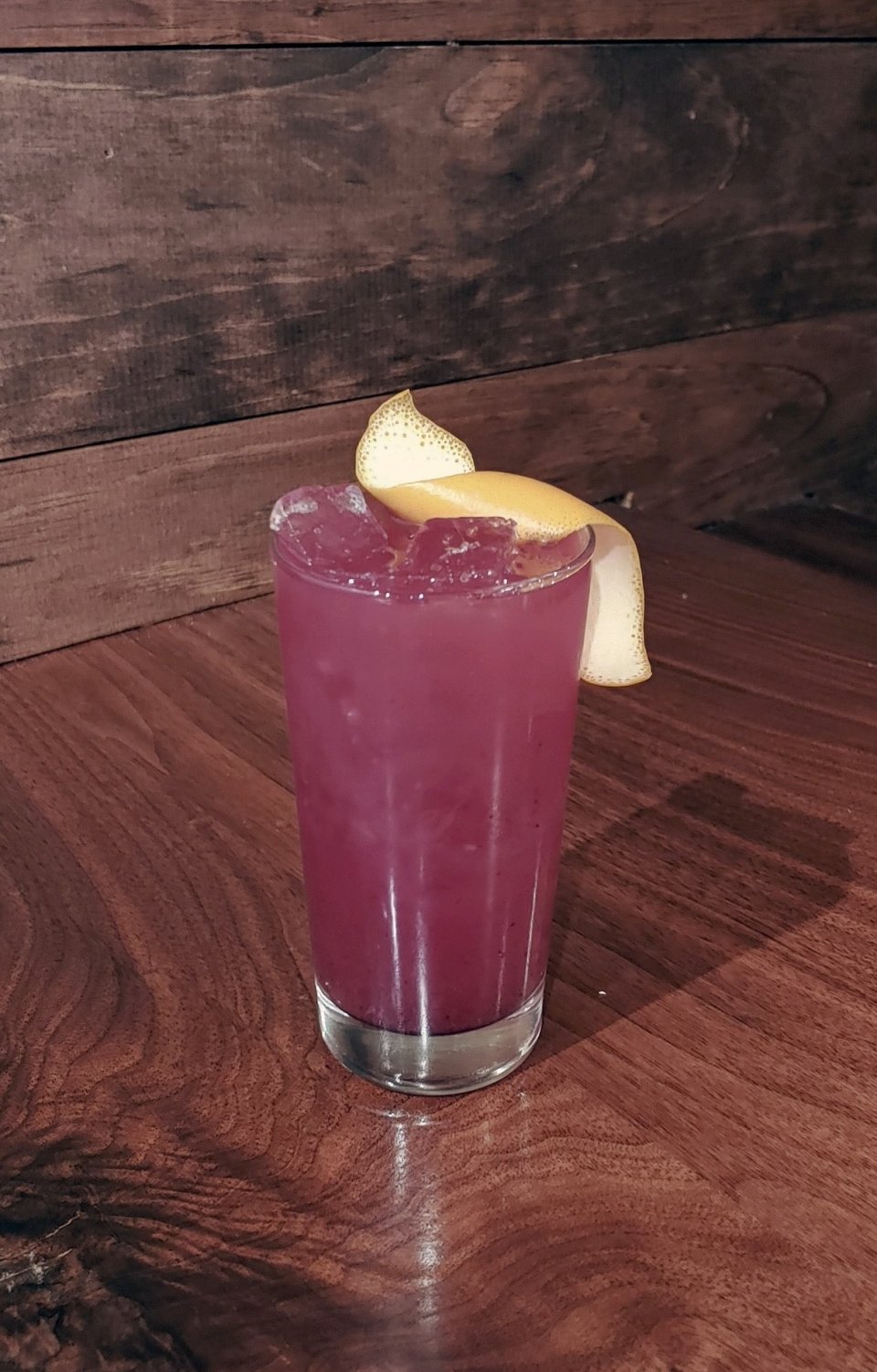 Home Grown Cafe's Violet Turning Violet mocktail is made with Seedlip Spice 94, grapefruit juice, blueberry rose water purée, Babas Brew Flower Power kombucha, blueberries and a grapefruit twist.