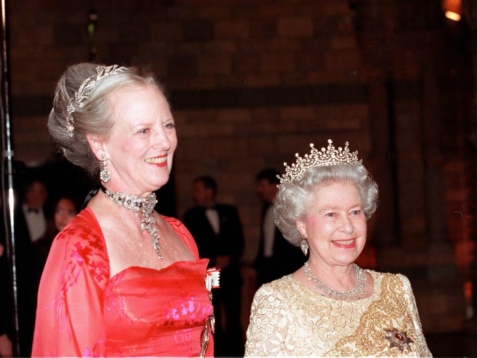 Queen Elizabeth II and Danish Queen Margrethe of Denmark attend a reception at the Natural History Museum on February 17, 2000.