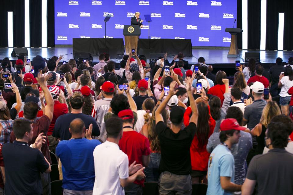 President Donald Trump points to the crowd while concluding his remarks at the "Students for Trump" rally at Dream City Church in Phoenix on June 23, 2020.