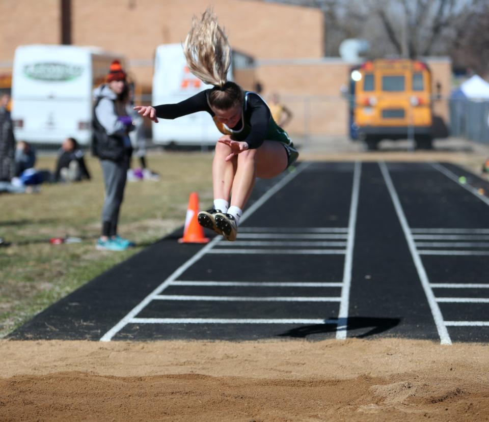 Aberdeen Roncalli's Morgan Fiedler competes in the triple jump at the Redfield Relays on April 21, 2022.