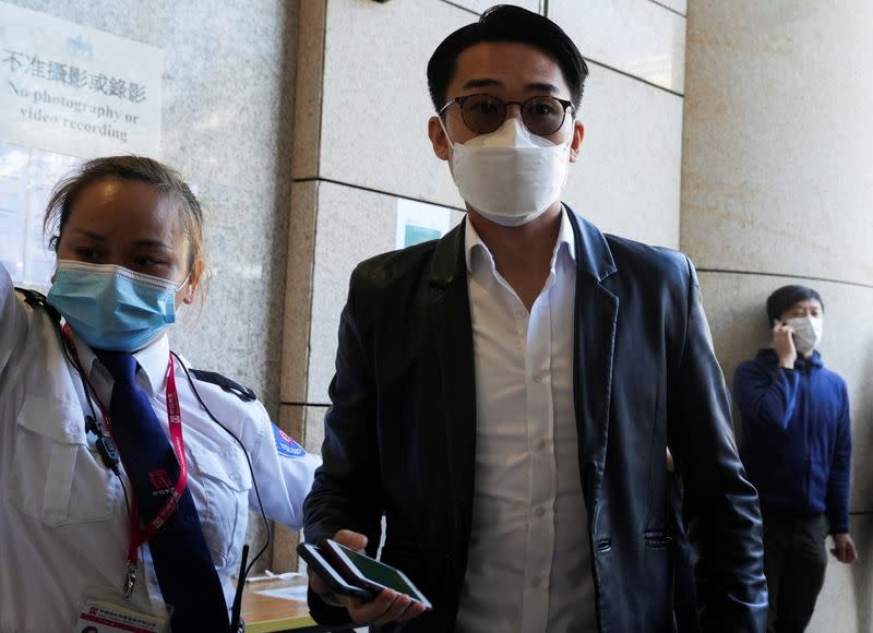 Pang Cheuk-Kei arrives at West Kowloon Magistrates' Courts building to take part in a hearing, in Hong Kong