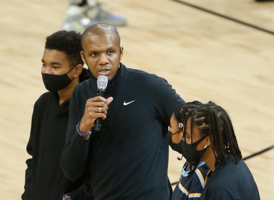 June 20, 2021; Phoenix, Arizona, USA; Suns' general manager James Jones speaks to the crowd with his children after winning the NBA Executive of the Year prior to game 1 against the Clippers at the Phoenix Suns Arena.