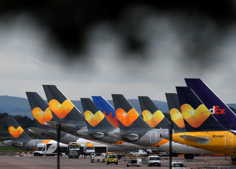 Thomas Cook logos are pictured on the tailfins of the company's passenger aircraft parked on tarmac at Manchester Airport in Manchester, northern England on September 23, 2019. Photo: OLI SCARFF/AFP/Getty Images