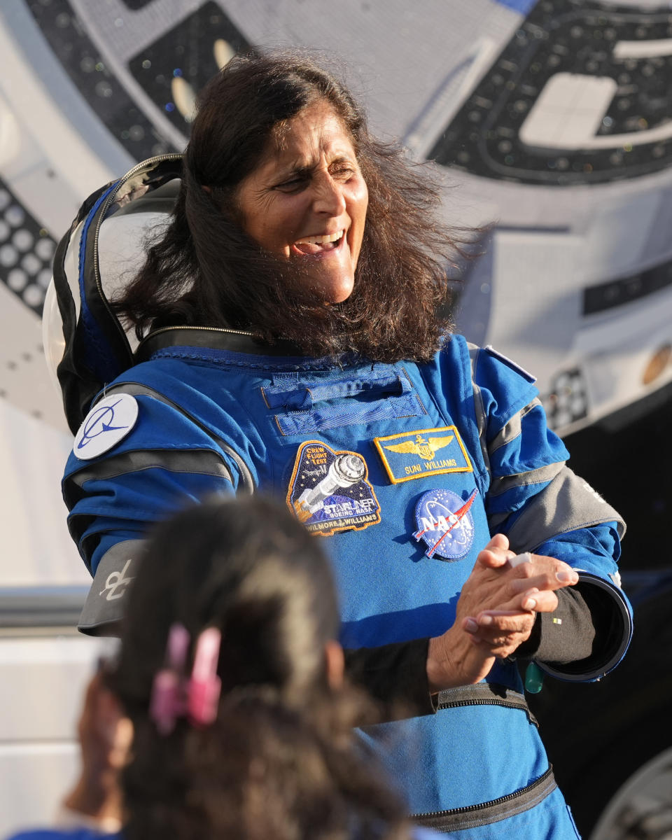 NASA astronaut Suni Williams laughs with relatives as she leaves the Operations and Checkout building before heading to Space Launch Complex 41 to board the Boeing's Starliner capsule atop an Atlas V rocket for a mission to the International Space Station at the Cape Canaveral Space Force Station, Monday, May 6, 2024, in Cape Canaveral, Fla. (AP Photo/John Raoux)