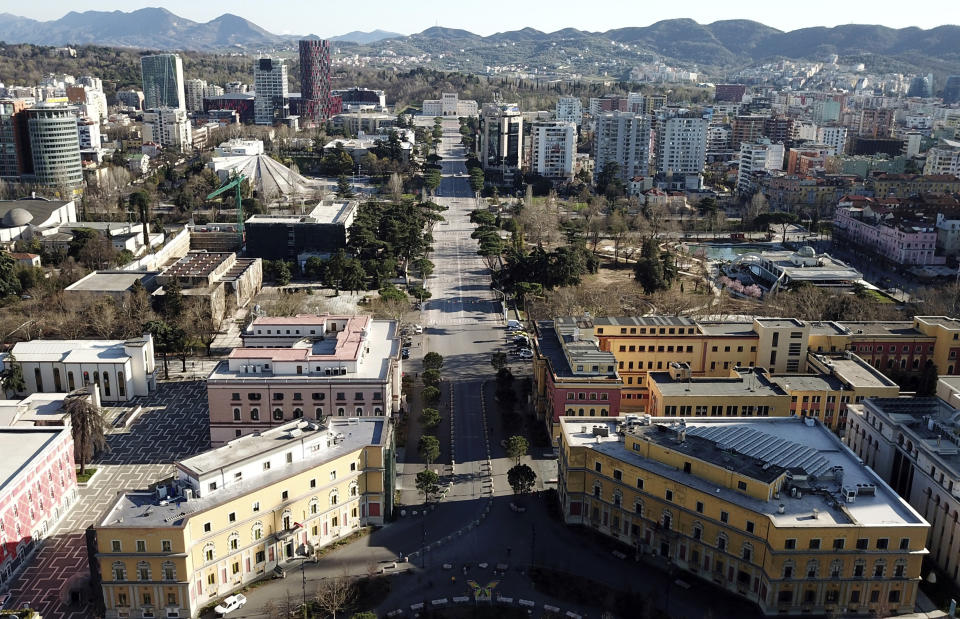 FILE -The main Durresi avenue is seen from above in Tirana, Tuesday, March 17, 2020. The European Union and Germany say they will give Albania nearly $88 million to turn the three main bus lines in the capital Tirana electric, part of helping the Balkan country meet requirements to join the 27-nation bloc.(AP Photo/Hektor Pustina, File)
