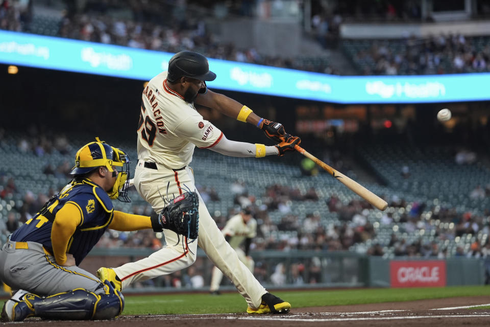 San Francisco Giants' Jerar Encarnacion hits a two-run home run during the first inning of a baseball game against the Milwaukee Brewers, Wednesday, Sept. 11, 2024, in San Francisco. (AP Photo/Godofredo A. Vásquez)