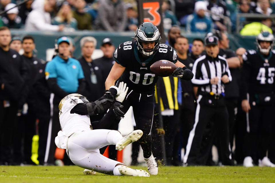 Philadelphia Eagles' Dallas Goedert (88) catches a pass against New Orleans Saints' Kwon Alexander (5) during the first half of an NFL football game, Sunday, Nov. 21, 2021, in Philadelphia. (AP Photo/Matt Rourke)