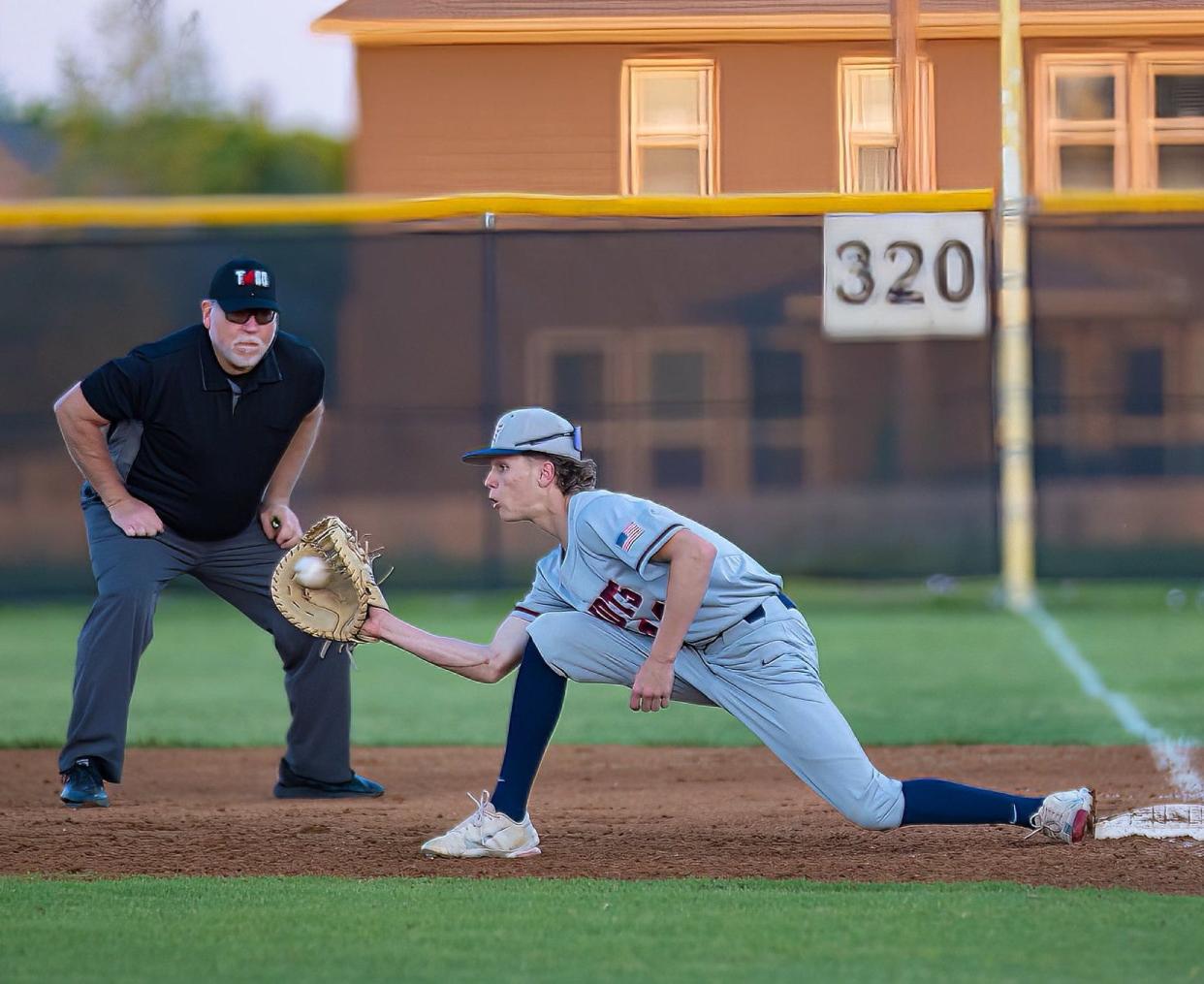 East View Patriots Asher Kirchoff (14) forces the out during the third inning at the District 23-5A baseball game on Tuesday, April 11, 2023, at Hendrickson High School in Pflugerville, TX.