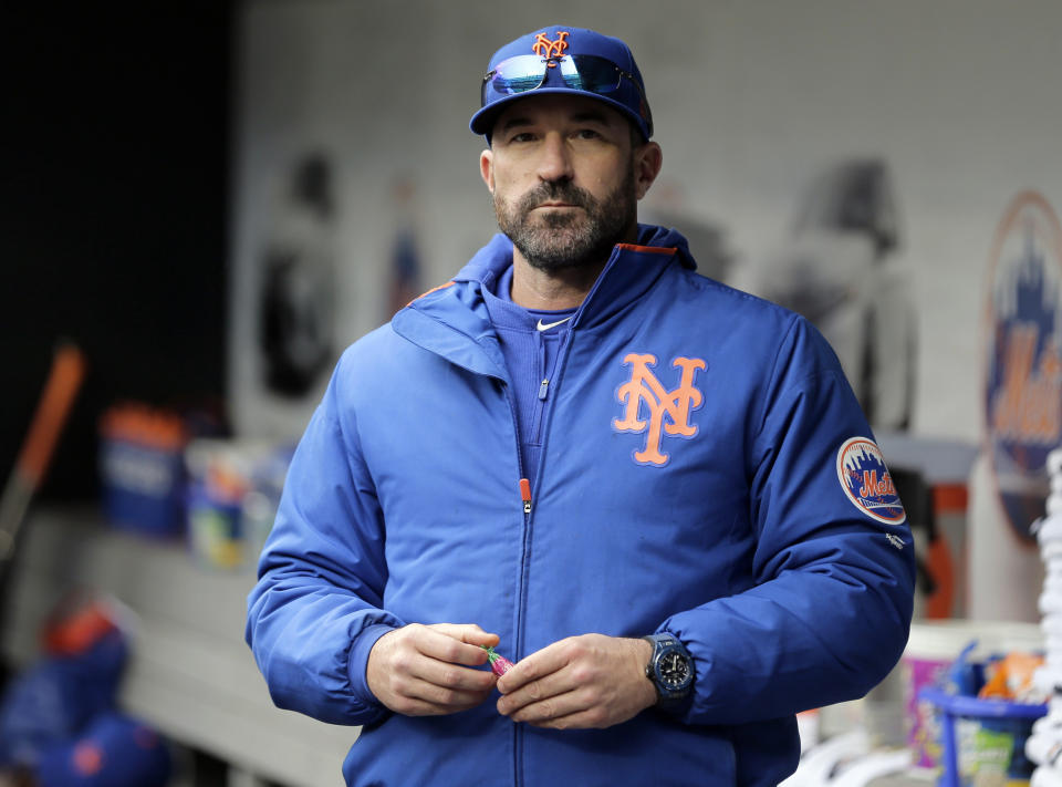 FILE - In this Sunday, April 28, 2019, file photo, then-New York Mets manager Mickey Callaway stands by the dugout before a baseball game against the Milwaukee Brewers at Citi Field, in New York. Callaway, former manager of the New York Mets and current Los Angeles Angels pitching coach, “aggressively pursued” several women who work in sports media and sent three of them inappropriate photos, The Athletic reported Monday, Feb. 1, 2021. (AP Photo/Seth Wenig, File)