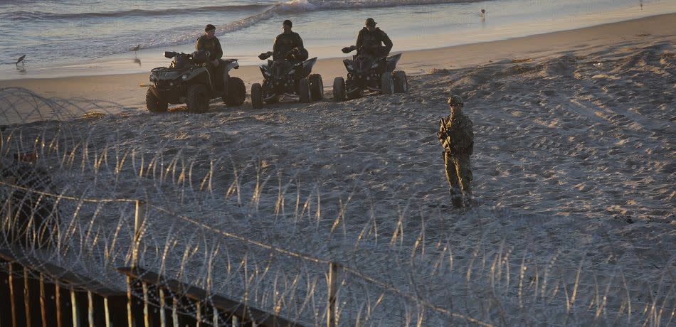 U.S. Border Patrol agents stand vigil at the border with Mexico on November 16, 2018 in San Diego, CA as seen from Tijuana, Mexico.