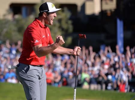 Jan 29, 2017; La Jolla, CA, USA; Jon Rahm celebrates after a eagle on the 18th hole during the final round of the Farmers Insurance Open golf tournament at Torrey Pines Municipal Golf Course - South Co. Mandatory Credit: Orlando Ramirez-USA TODAY Sports