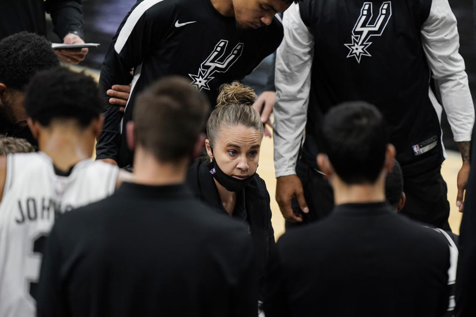 San Antonio Spurs assistant coach Becky Hammon calls a play during a timeout in the second half of an NBA basketball game against the Los Angeles Lakers in San Antonio, Wednesday, Dec. 30, 2020. (AP Photo/Eric Gay)