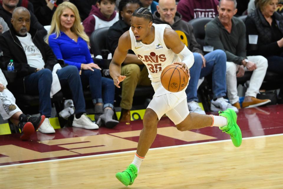 Cavaliers forward Isaac Okoro (35) brings the ball up court against the Orlando Magic during Game 1 of a first-round NBA playoff series April 20 in Cleveland.