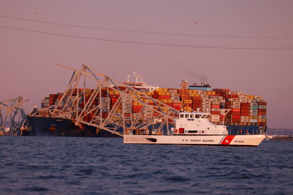 A US Coast Guard vessel secures the perimeter (REUTERS)