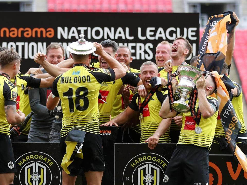 Harrogate Town players celebrate their historic win at Wembley Stadium: Getty