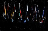 Gold Coast 2018 Commonwealth Games - Closing Ceremony - Carrara Stadium - Gold Coast, Australia - April 15, 2018. Volunteers carry the national flags during the closing ceremony. REUTERS/David Gray