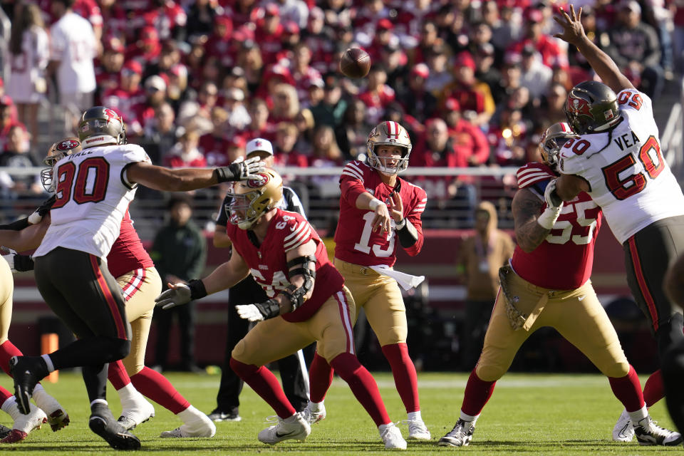 San Francisco 49ers quarterback Brock Purdy (13) passes against the Tampa Bay Buccaneers during the first half of an NFL football game in Santa Clara, Calif., Sunday, Nov. 19, 2023. (AP Photo/Godofredo A. Vásquez)