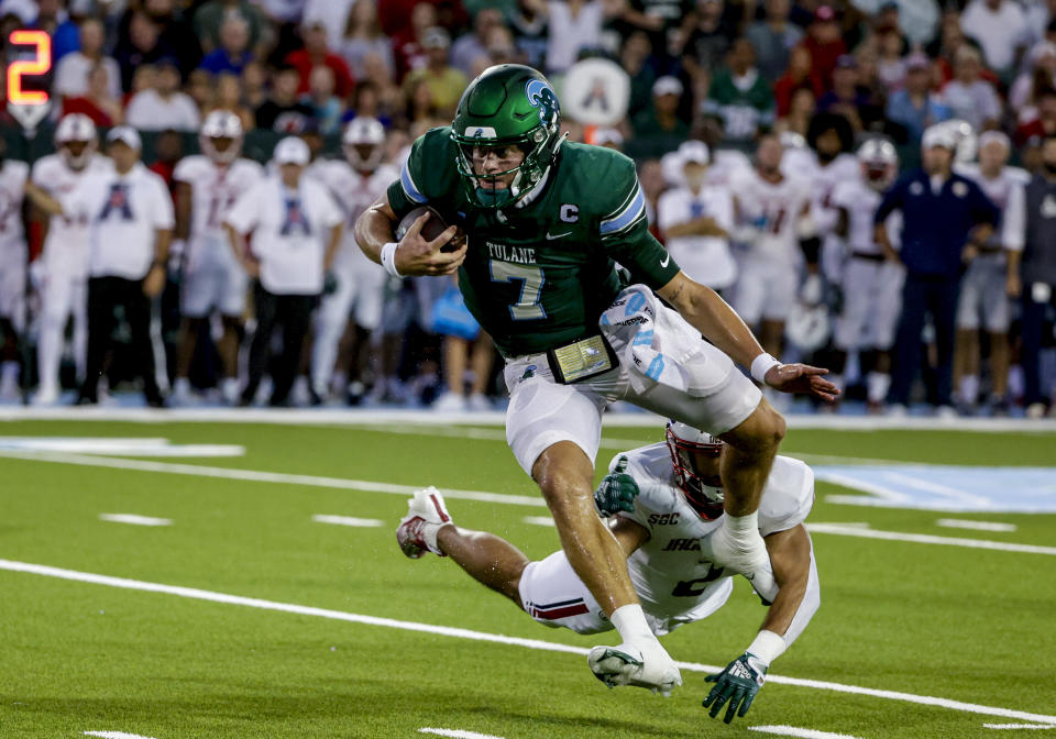 Tulane quarterback Michael Pratt (7) breaks away from South Alabama safety Jaden Voisin (2) during the first quarter of an NCAA college football game in New Orleans, Saturday, Sept. 2, 2023. (AP Photo/Derick Hingle)