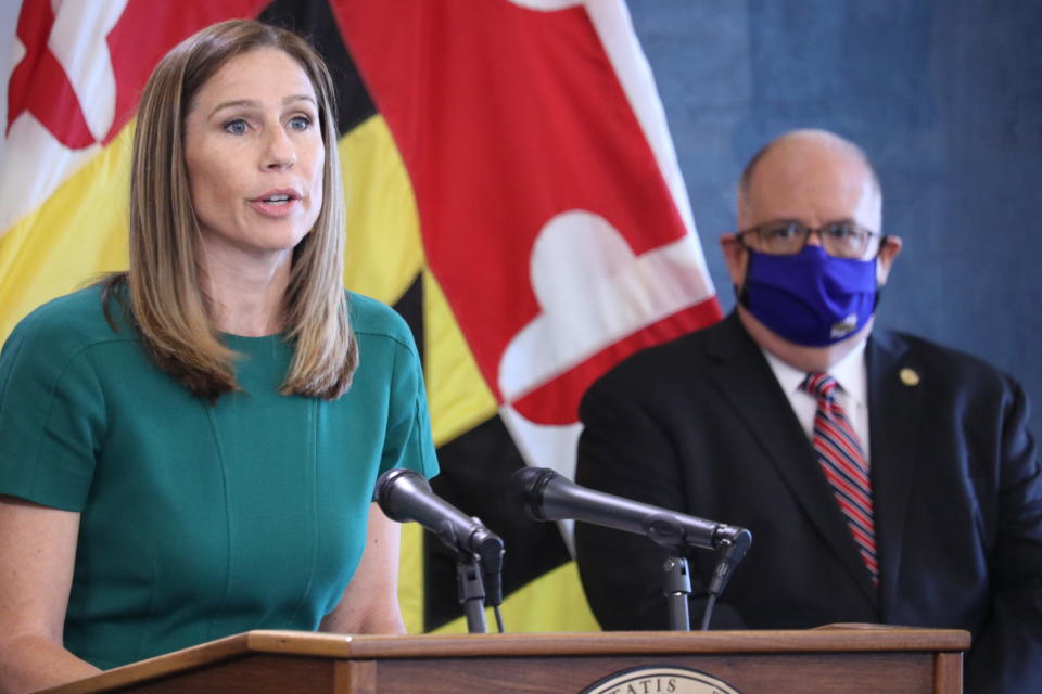 Maryland Labor Department Secretary Tiffany Robinson talks about the state's uncovering of more than 47,500 fraudulent unemployment insurance claims totaling more than $501 million at a news conference in Annapolis, Md., on Wednesday, July, 15, 2020. Gov. Larry Hogan is standing right. (AP Photo/Brian Witte