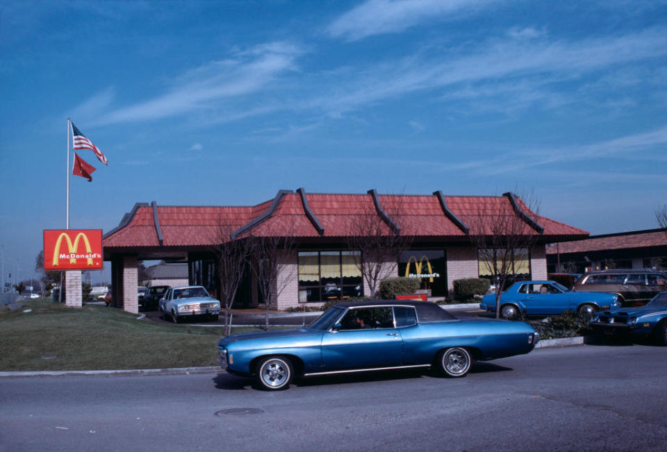 McDonald's from the early 80s with cars in line for drive thru