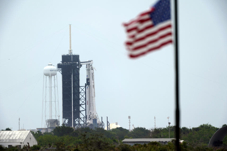 The SpaceX Falcon 9, with the Crew Dragon spacecraft on top of the rocket, sits on Launch Pad 39-A, Monday, May 25, 2020, at Kennedy Space Center, Fla. Two astronauts will fly on the SpaceX Demo-2 mission to the International Space Station scheduled for launch on May 27. (AP Photo/David J. Phillip)