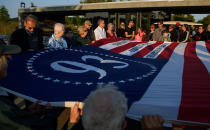 <p>Visitors unfurl a commemorative flag at the Flight 93 National Memorial on the 16th Anniversary ceremony of the Sept. 11 terrorist attacks, Sept. 10, 2017, in Shanksville, Pa. United Airlines Flight 93 crashed into a field outside Shanksville with 40 passengers and four hijackers aboard on Sept. 11, 2001. (Photo: Jeff Swensen/Getty Images) </p>