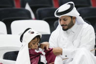 Fans arrive for the World Cup group A soccer match between the Netherlands and Qatar, at the Al Bayt Stadium in Al Khor , Qatar, Tuesday, Nov. 29, 2022. (AP Photo/Darko Bandic)