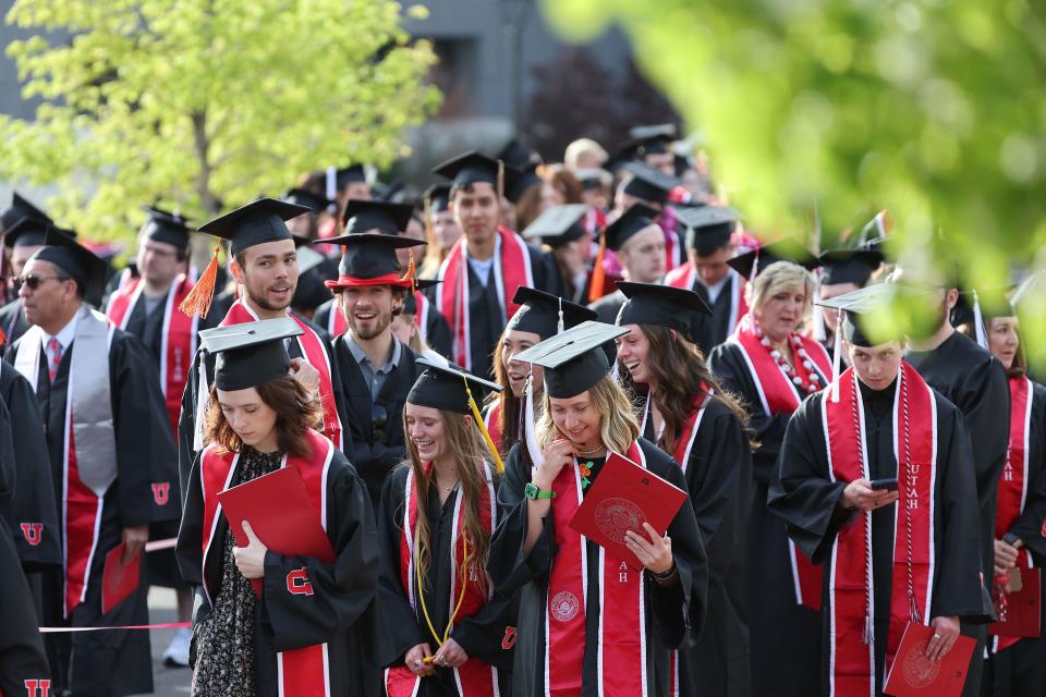 Students walk during the the University of Utah’s commencement in Salt Lake City on Thursday, May 4, 2023. With 8,723 graduates, it is the largest group of graduates in the school’s history. | Jeffrey D. Allred, Deseret News