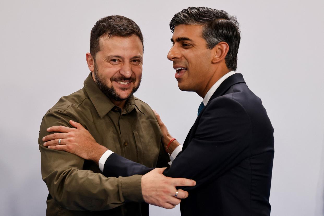 TOPSHOT - Ukraine's President Volodymyr Zelensky (L) is greeted by British Prime Minister Rishi Sunak at the start of a plenary session of the European Political Community summit at the Palacio de Congreso in Granada, southern Spain on October 5, 2023. Europe's quest to build a common geopolitical purpose brought four dozen of its leaders to Granada, but its credibility suffered a blow when the Azerbaijani president stayed away. (Photo by Ludovic MARIN / AFP) (Photo by LUDOVIC MARIN/AFP via Getty Images)
