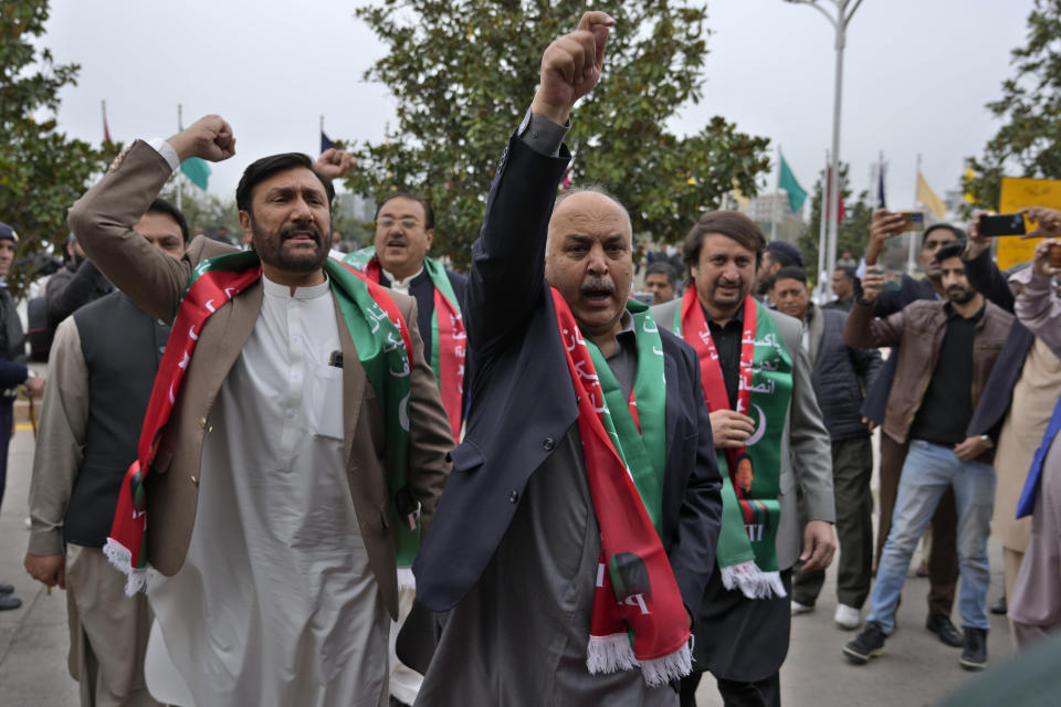 Pakistan's newly elected lawmakers backed by imprisoned former Prime Minister Imran Khan's party chant slogans as they arrive to attend the opening session of parliament, in Islamabad, Pakistan, Thursday, Feb. 29, 2024. Pakistan's National Assembly swore in newly elected members on Thursday in a chaotic scene, as allies of jailed former Premier Khan protested what they claim was a rigged election. (AP Photo/Anjum Naveed)