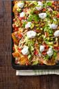 <p>If there aren't nachos at the party, the Super Bowl can't happen. </p><p>Get the <strong><a href="http://www.countryliving.com/food-drinks/recipes/a41067/friday-night-loaded-nachos/" rel="nofollow noopener" target="_blank" data-ylk="slk:Loaded Nachos recipe;elm:context_link;itc:0;sec:content-canvas" class="link ">Loaded Nachos recipe</a></strong> from Country Living. <br></p>