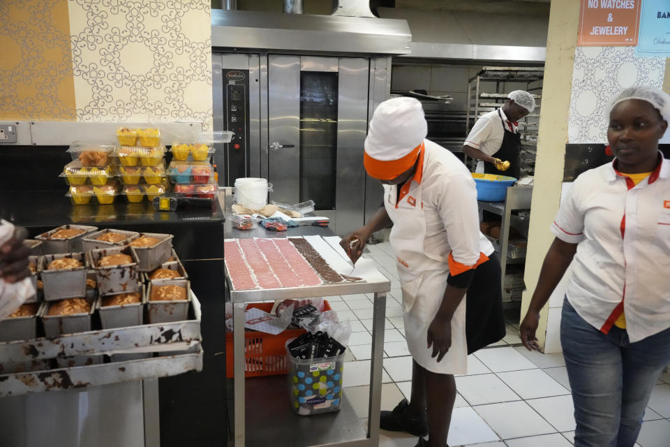 A employer prepares cake pastries at a bakery Friday, Oct 27, 2023. in Nairobi, Kenya. Kenya, once self-sufficient in sugar, now imports 200,000 metric tons a year from a regional trade bloc. (AP Photo/Sayyid Abdul Azim)