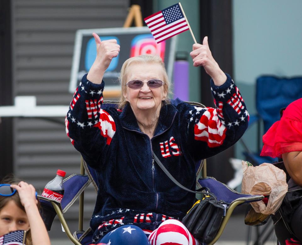 Attendees watch floats during the Mishawaka Memorial Day Parade Monday, May 27, 2019, in downtown Mishawaka. The parade resumes on Monday after a four-year hiatus.