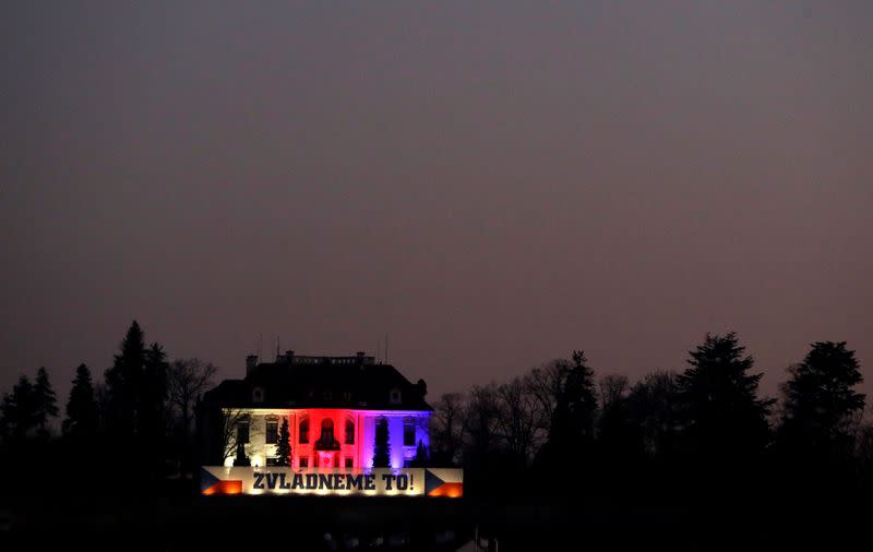 The Kramar's Villa, illuminated in the colors of the national flag of the Czech Republic, is seen in Prague