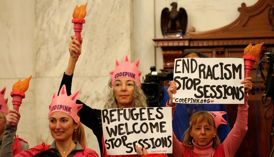 Fairooz, center, at Sessions' confirmation hearing in January, before&nbsp;her arrest. (Photo: Kevin Lamarque/Reuters)