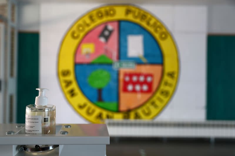 FILE PHOTO: Disinfectant gel is seen at the entrance of San Juan Bautista school during the coronavirus outbreak, in Arganda del Rey, near Madrid, Spain